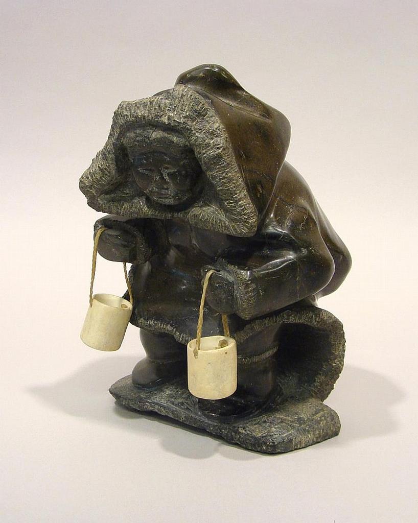 Markosie Stoney - Iqaluit a serpentine carving of an Inuk carrying water