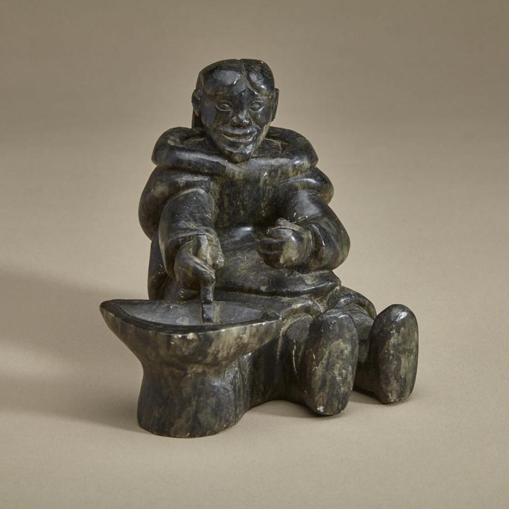 Mannumi Shaqu (1917-2000) - Seated Woman Tending A Qulliq