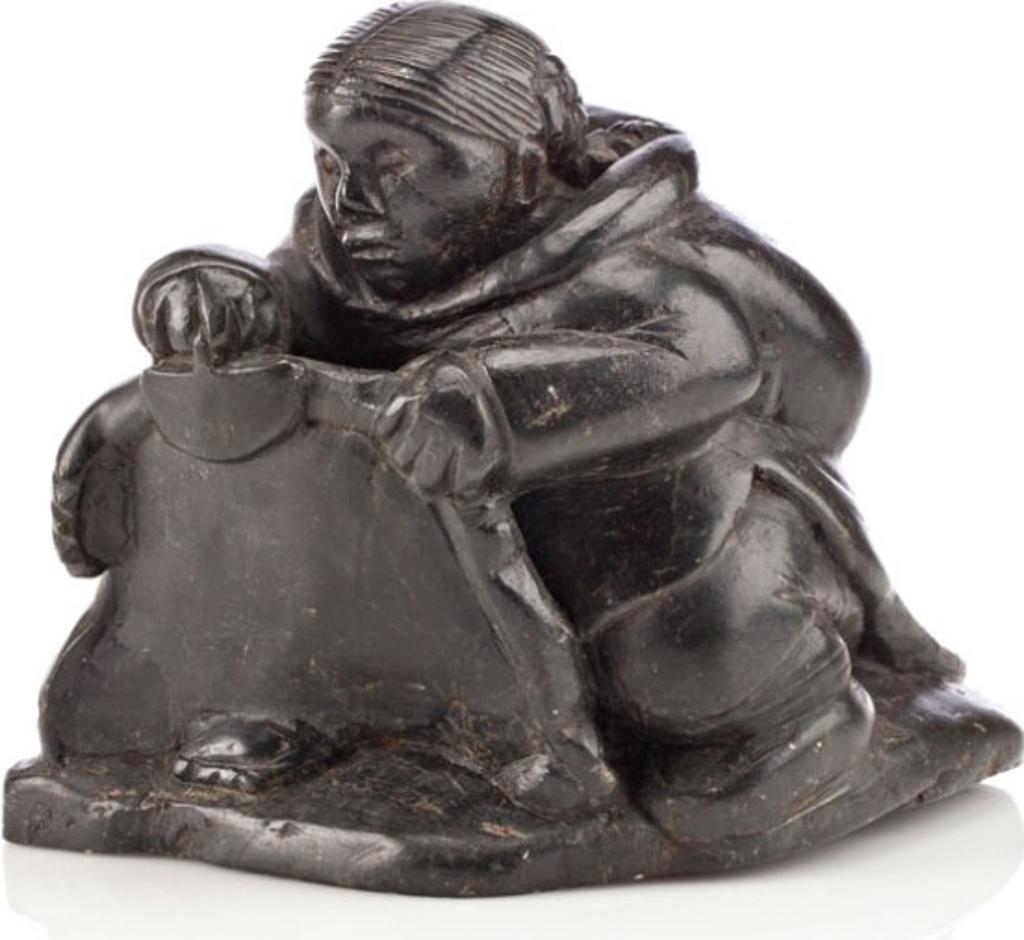 Silassie Tukai (1919-1994) - Inukjuak, Woman Scraping a Skin,, Ca. late 1950s-early 1960s, Black stone