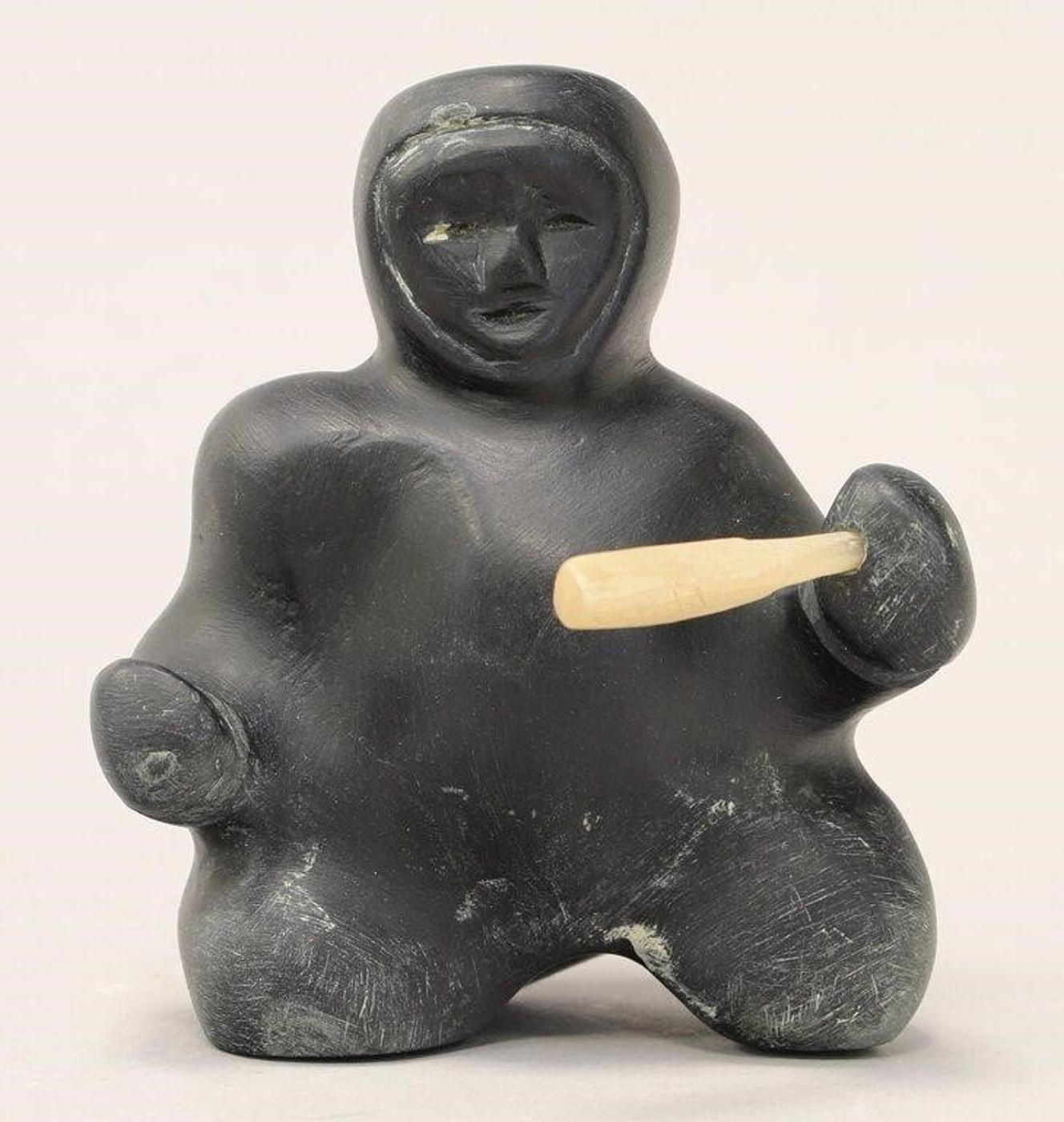 Toona Iqulik (1935-2015) - A basalt carving of a Kneeling Hunter