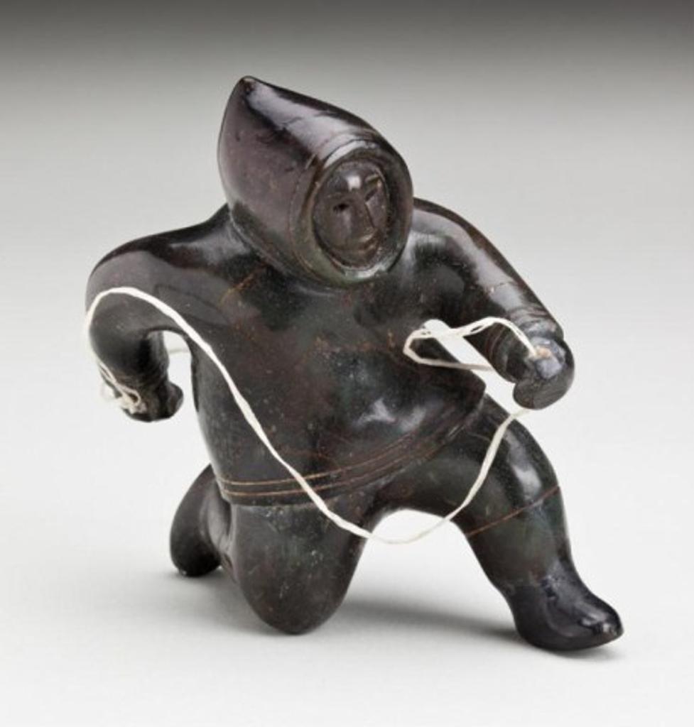 Akeeaktashuk (1898-1954) - Kneeling hunter, ca. 1951-53, warm black stone and sinew, 4.625 x 2.75 x 4.625 in, 11.3 x 7 x 11.3 cm