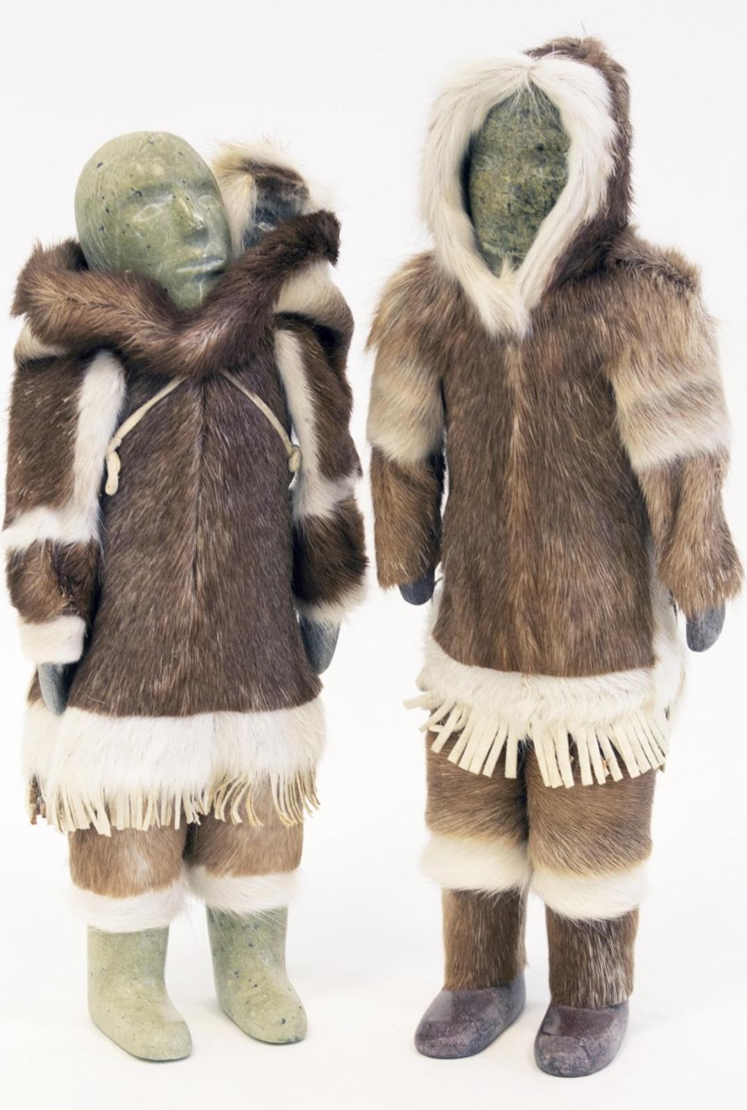 Inuit Dolls - male and female Inuit dolls. Carved stone, hide and fur