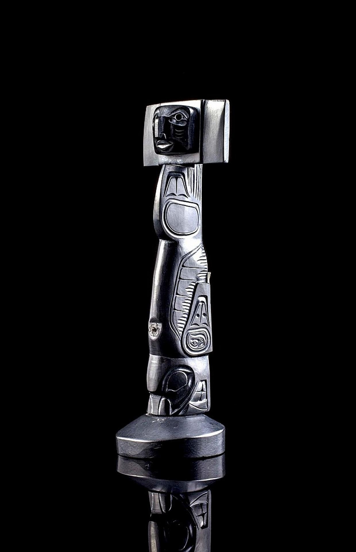 Glen Pollard (1957) - a carved argillite pole in the form of a house post