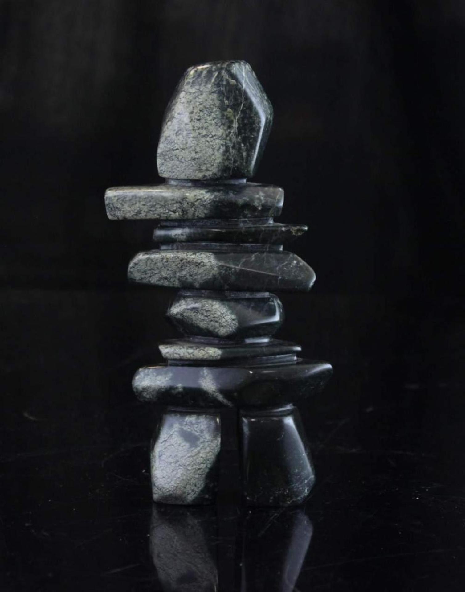 Miluqtoajuk - a green stone carving of an Inukshuk