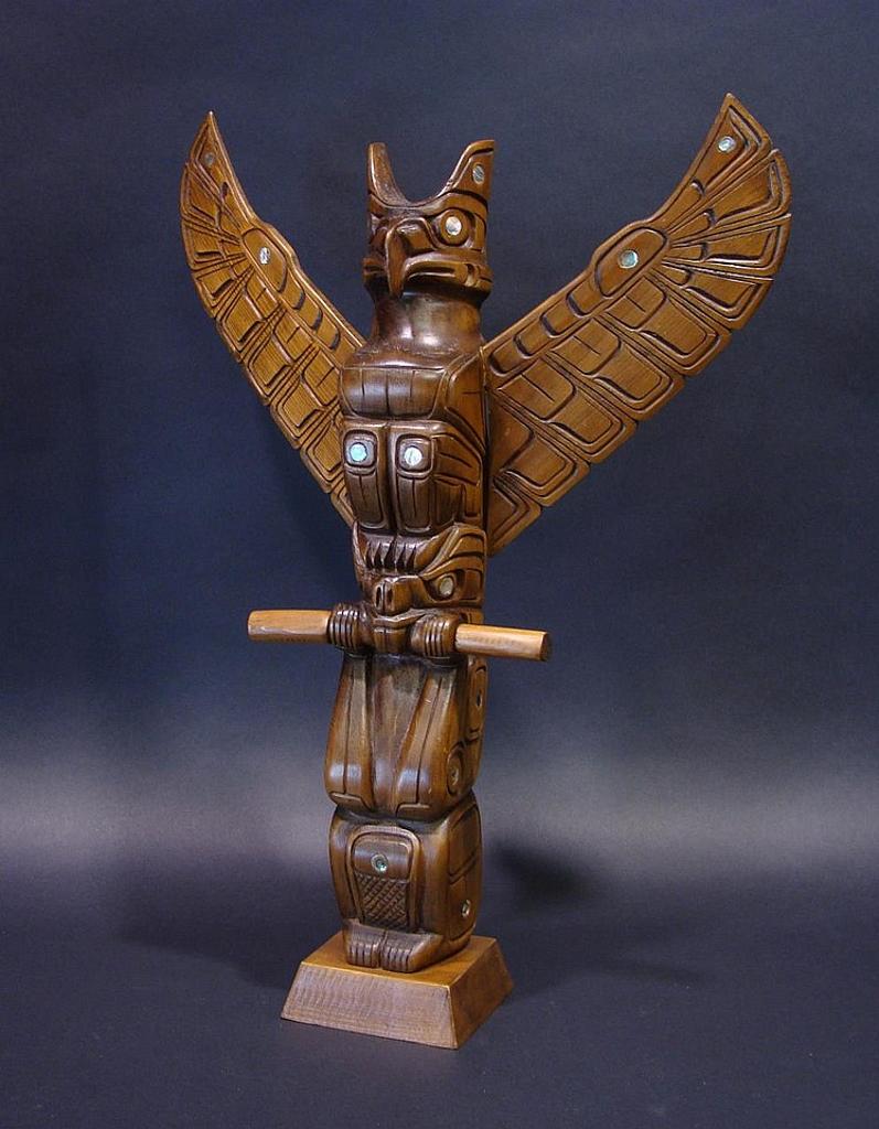 Roy Speck - a carved and stained pole depicting Thunderbird and Beaver