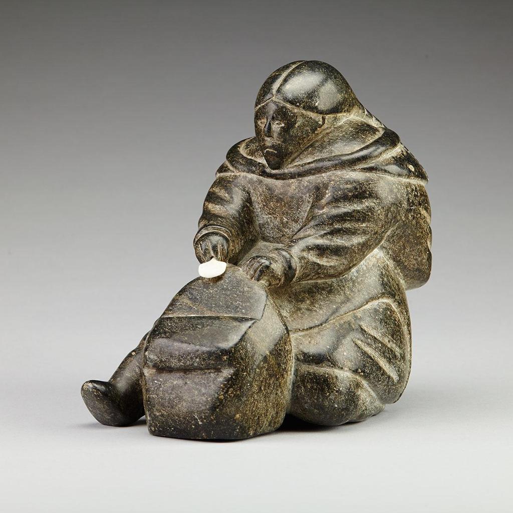 Annie Ikilluaq Saviakjuk (1938) - Seated Woman Scraping A Skin