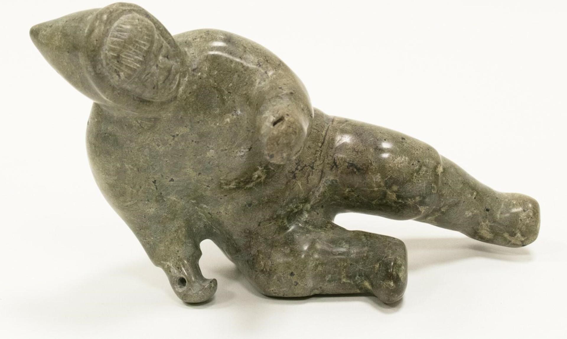 J. Peter - a serpentine carving of a a Man (tools missing); signed in Roman