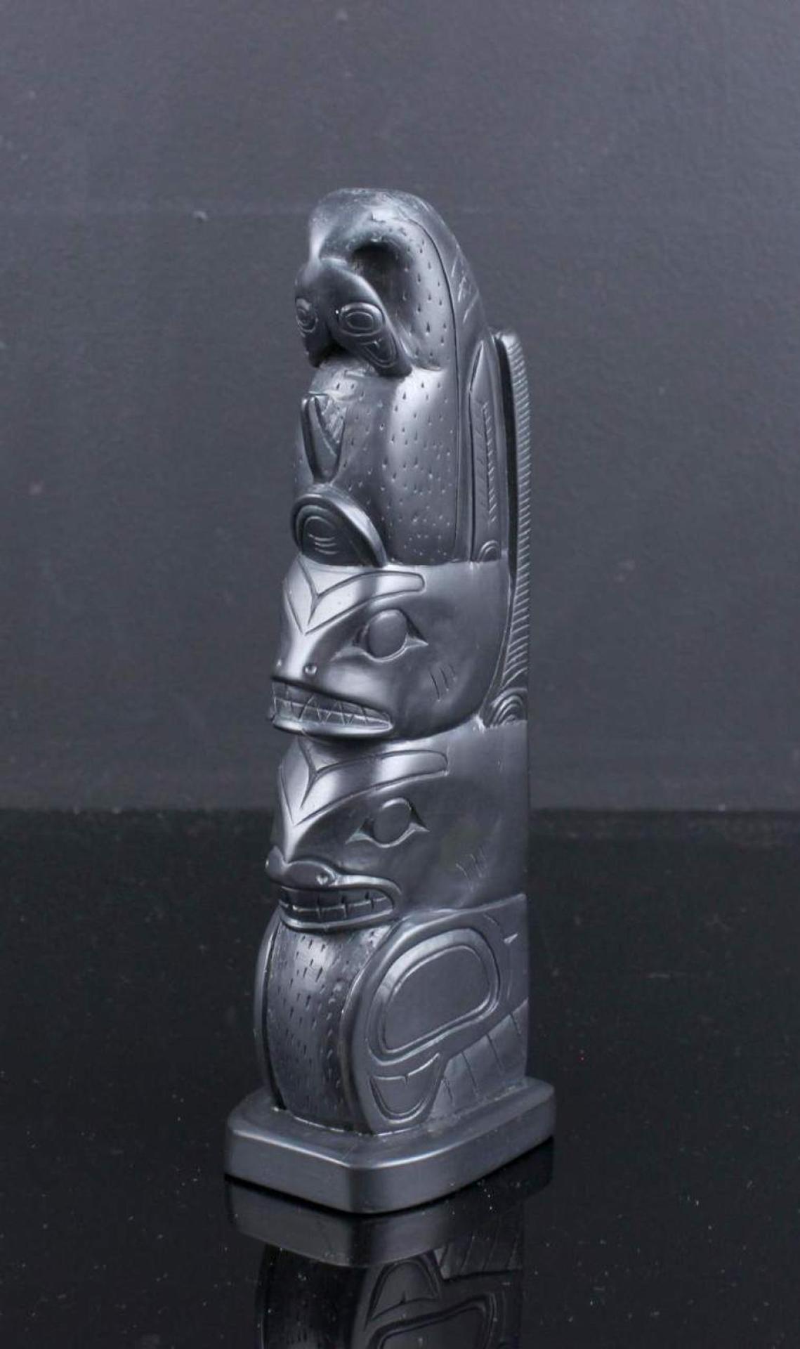 Herman Collinson - a carved argillite model pole depicting Killer Whale and Sea Bear