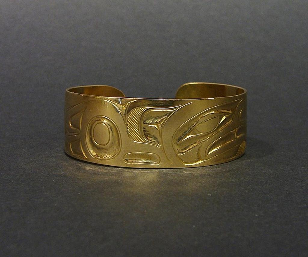 Donald (Don) Yeomans (1958) - a gold cuff bracelet with Thunderbird design