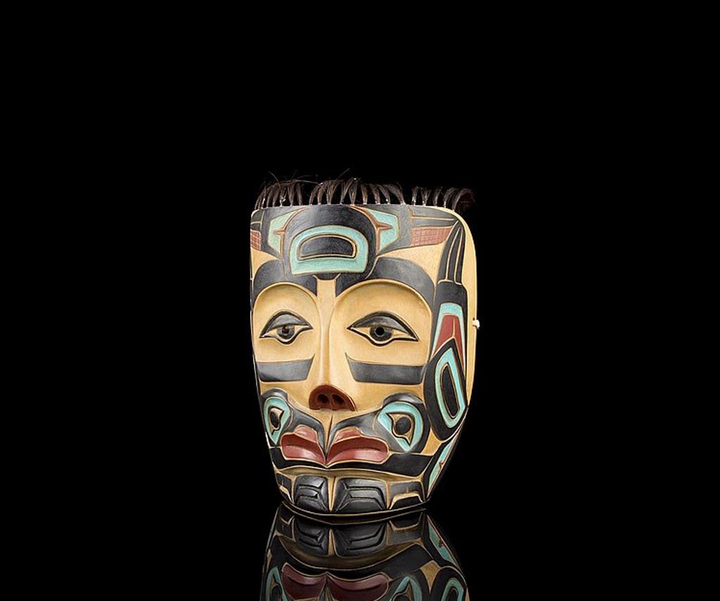 Ron A. Sebastian (1945) - a carved and polychromed Raven portrait mask