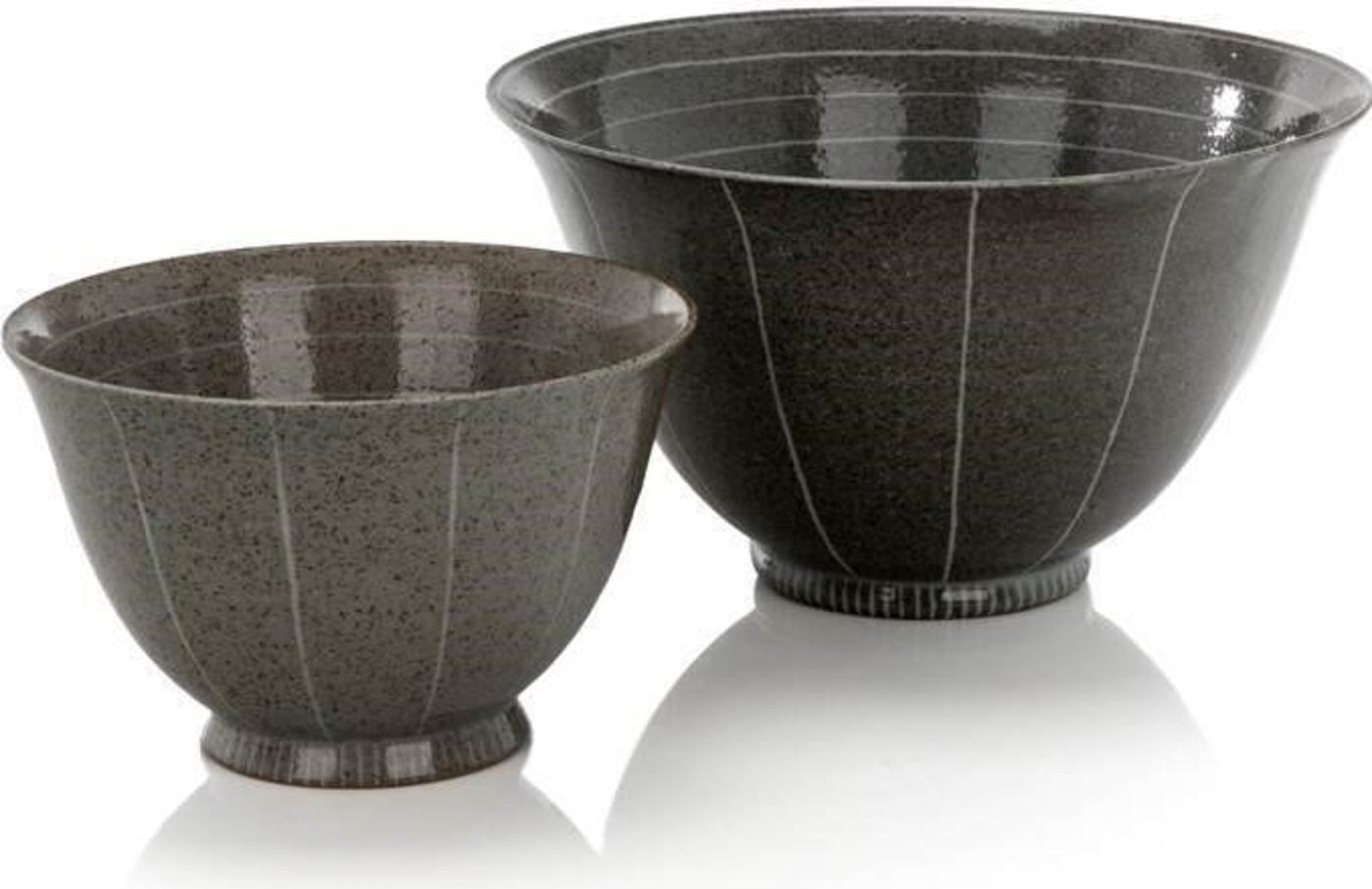 Karen Bunting (1949) - Two Stoneware bowls with white circular design throughout. Various Karen Bunting signatures on the bottom of both