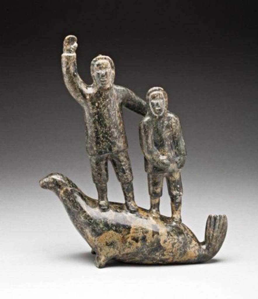 Abraham Etungat (1911-1999) - Father and son, standing on a seal, ca. mid-1980s
