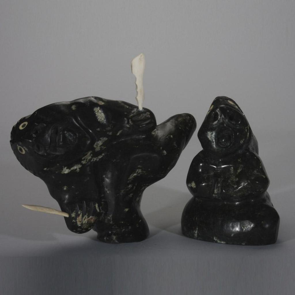 Uriash Puqiqnak (1946) - A Seated Shaman And A Shaman Holding A Spear (Both With Inset Eyes And Teeth)