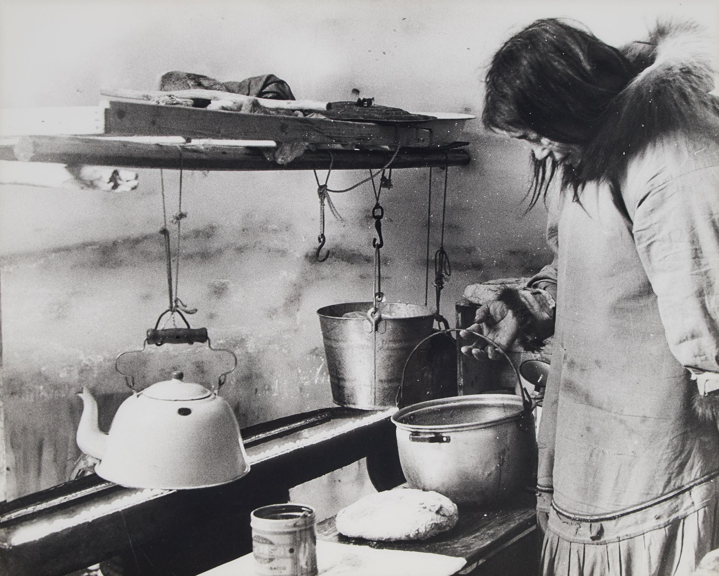 Richard Harrington (1911-2005) - Eskimo Woman Tending Her Kudele (Seal Oil Lamp) Inside Igloo Near Coppermine N.W.T., 1949