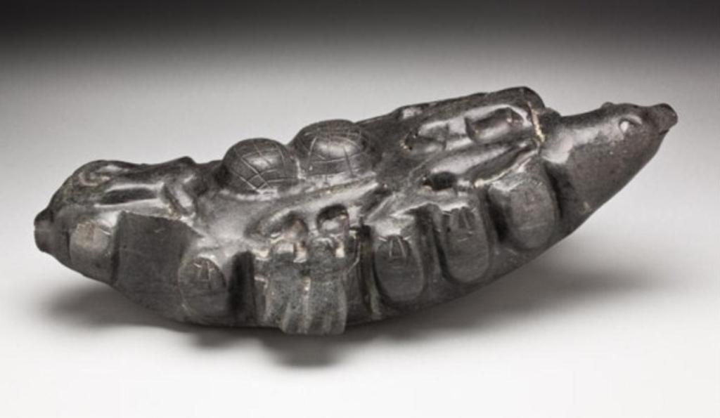 George Arlook Arluk (1949) - /BAKER LAKE/RANKIN INLET, The World, ca. 1975-77, dark grey stone, 7 x 23 x 11 in