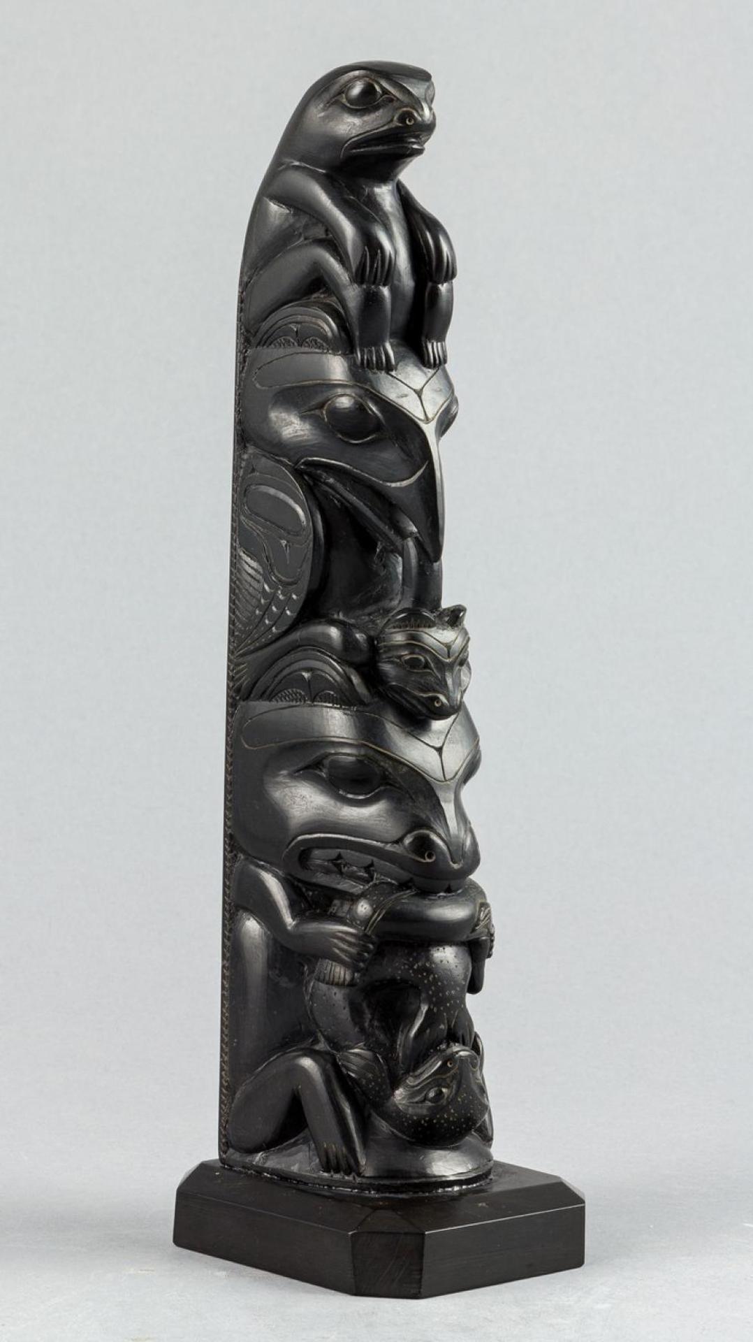 Louis Collinson (1881-1970) - a carved argillite pole depicting Frog