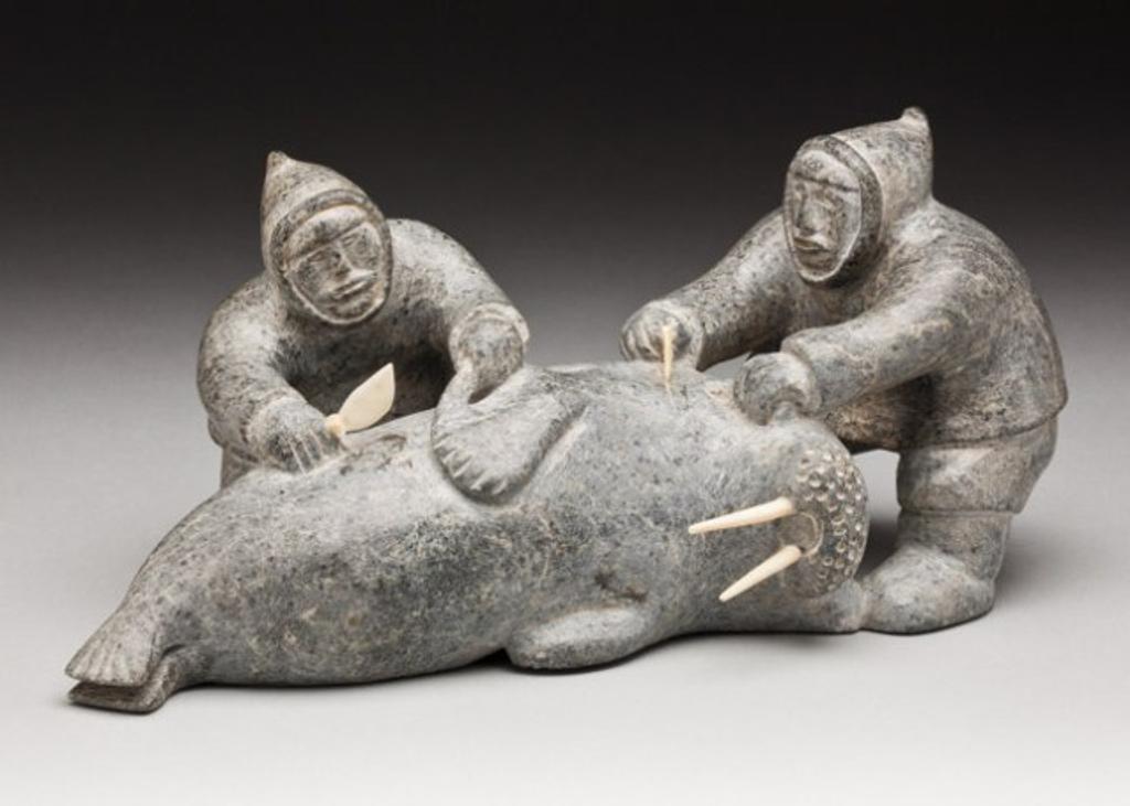 Isaaci Qurqaq Padlayat (1934) - Two hunters cutting up a walrus