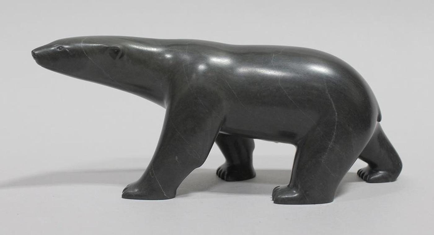 Lucassie Ippak (1972) - Grey-green stone carving of a Polar Bear