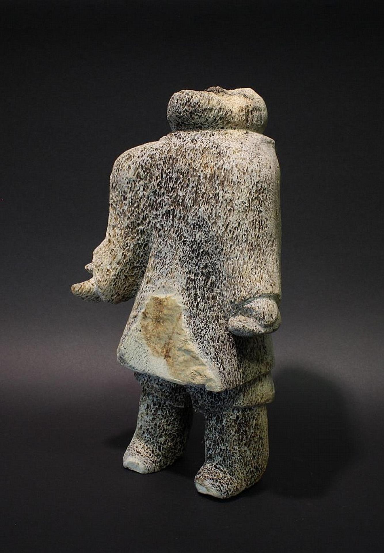 Tassonyut - a whalebone carving of a hunter