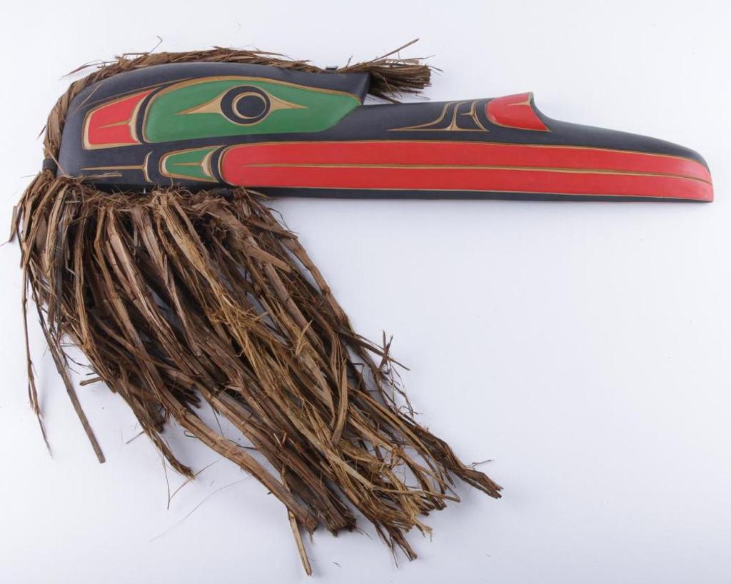 Matthew Baker - a carved and polychromed cedar Raven plaque with cedar strip hair.