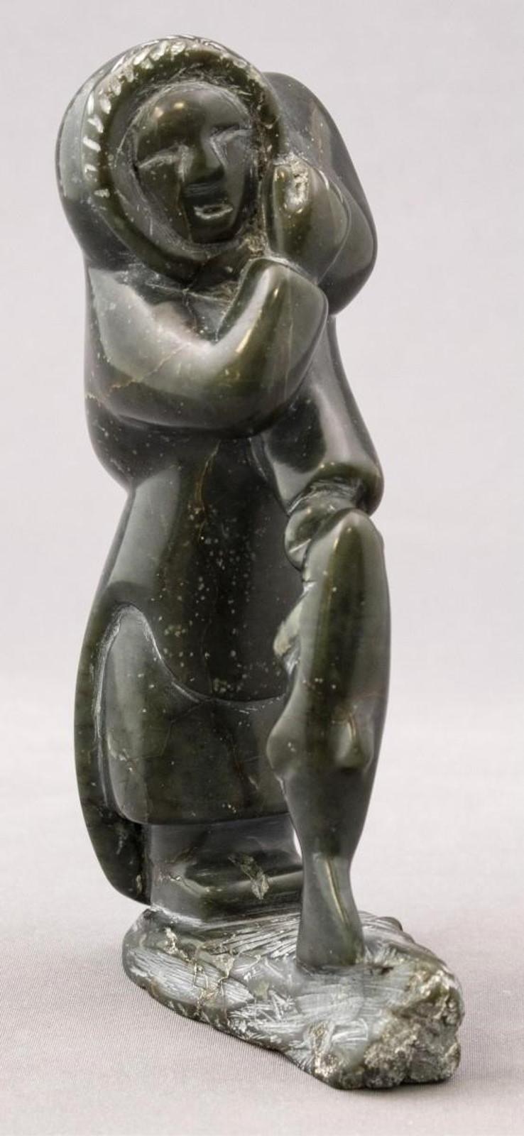 Oviloo Tunnillie (1949-2014) - Woman Carrying A Fish