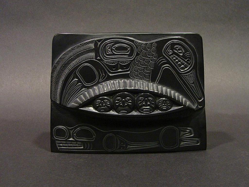 Glen Pollard (1957) - a carved argillite plaque depicting Mankind Emerging from Clam Shell
