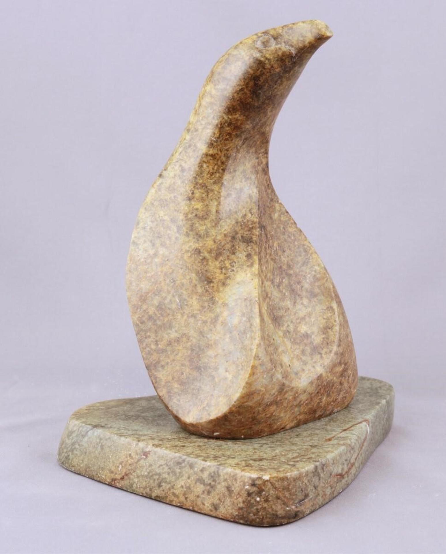 Mark Totan (1953) - a mottled orange carving of a Stylized Bird