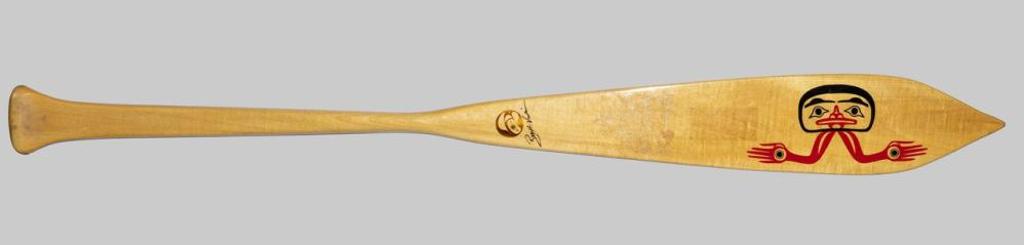 Roy Henry Vickers (1946) - a canoe paddle depicting a hand on one side and a man on the other side