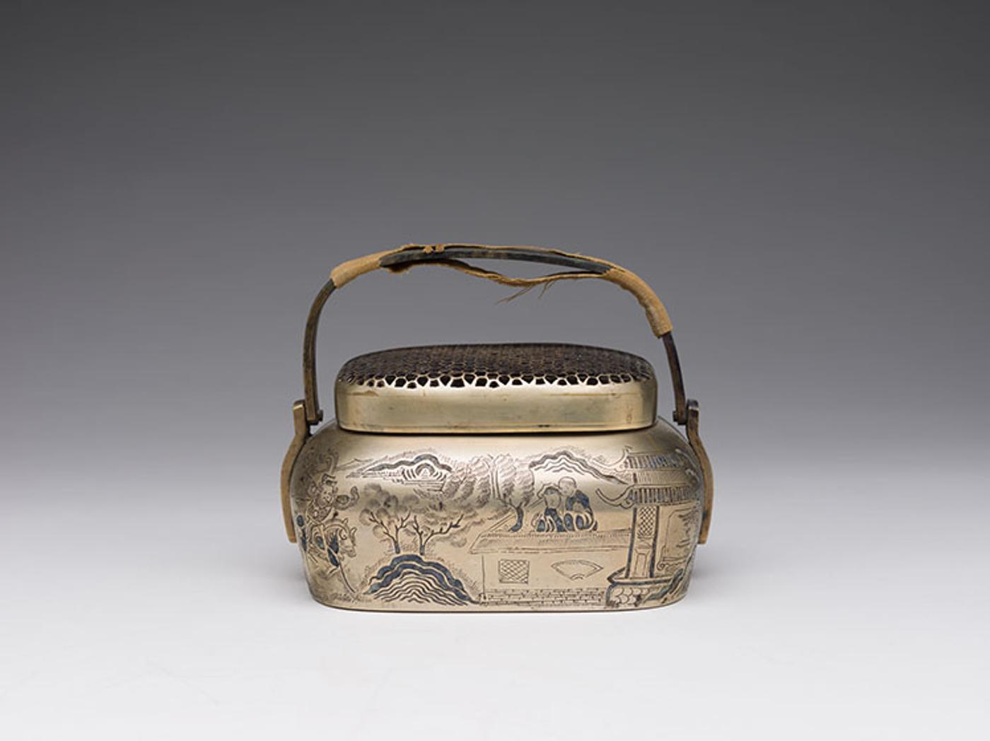 Chinese Art - A Chinese Brass Incised Landscape Hand Warmer, 19th Century