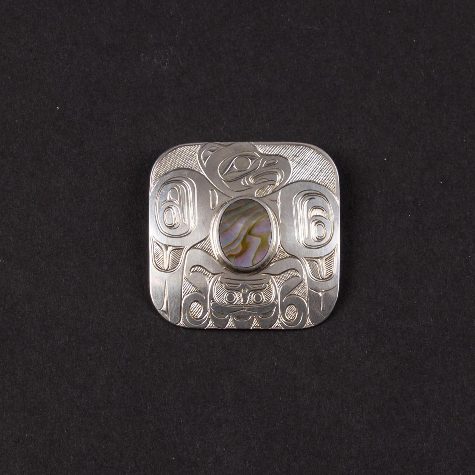 Derek Wilson (1950-2011) - a carved silver and abalone brooch/pendant