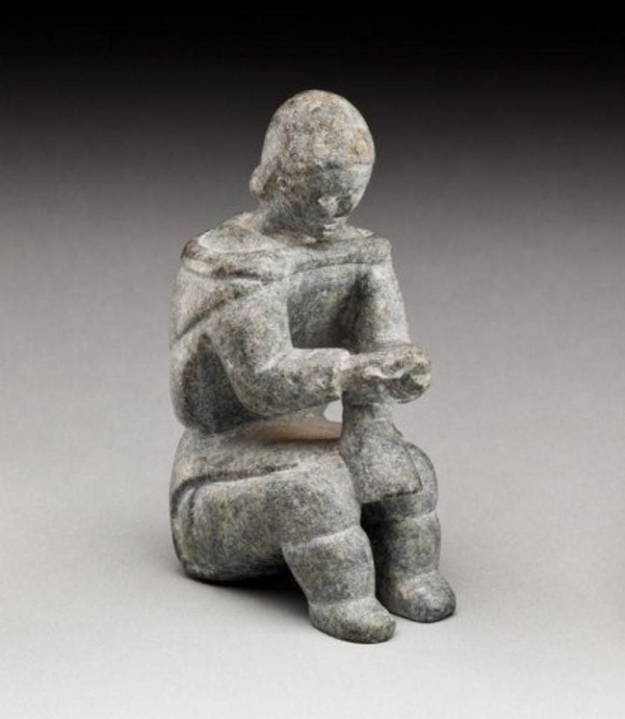 Evie Tullaugaq Qamugaaluk (1925) - Woman softening a boot