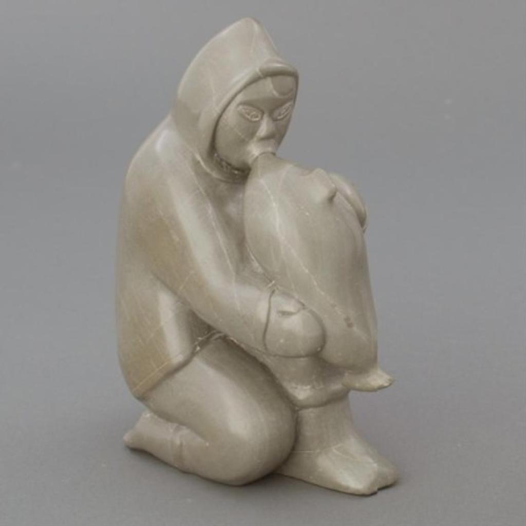 Elijassie Kavik (1947) - Green/Grey stone carving of a hunter inflating a seal float