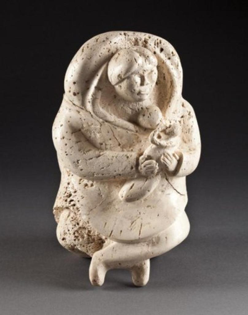 Nuveeya Ipellie (1920-2010) - Mother breastfeeding her child, 1969, whale bone, 10 x 6 x 5.5 in, 25.4 x 15.2 x 14 cm