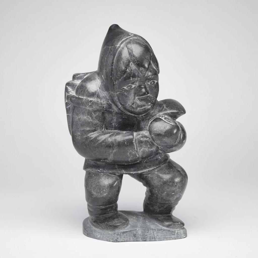 Adamie Aupalurta Putugu (1934) - Hunter With Heavy Pack Holding A Seal Flipper