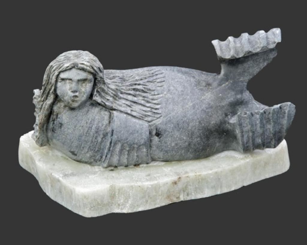 Mosha Michael (1948) - A stone carving depicting sedna on the ice