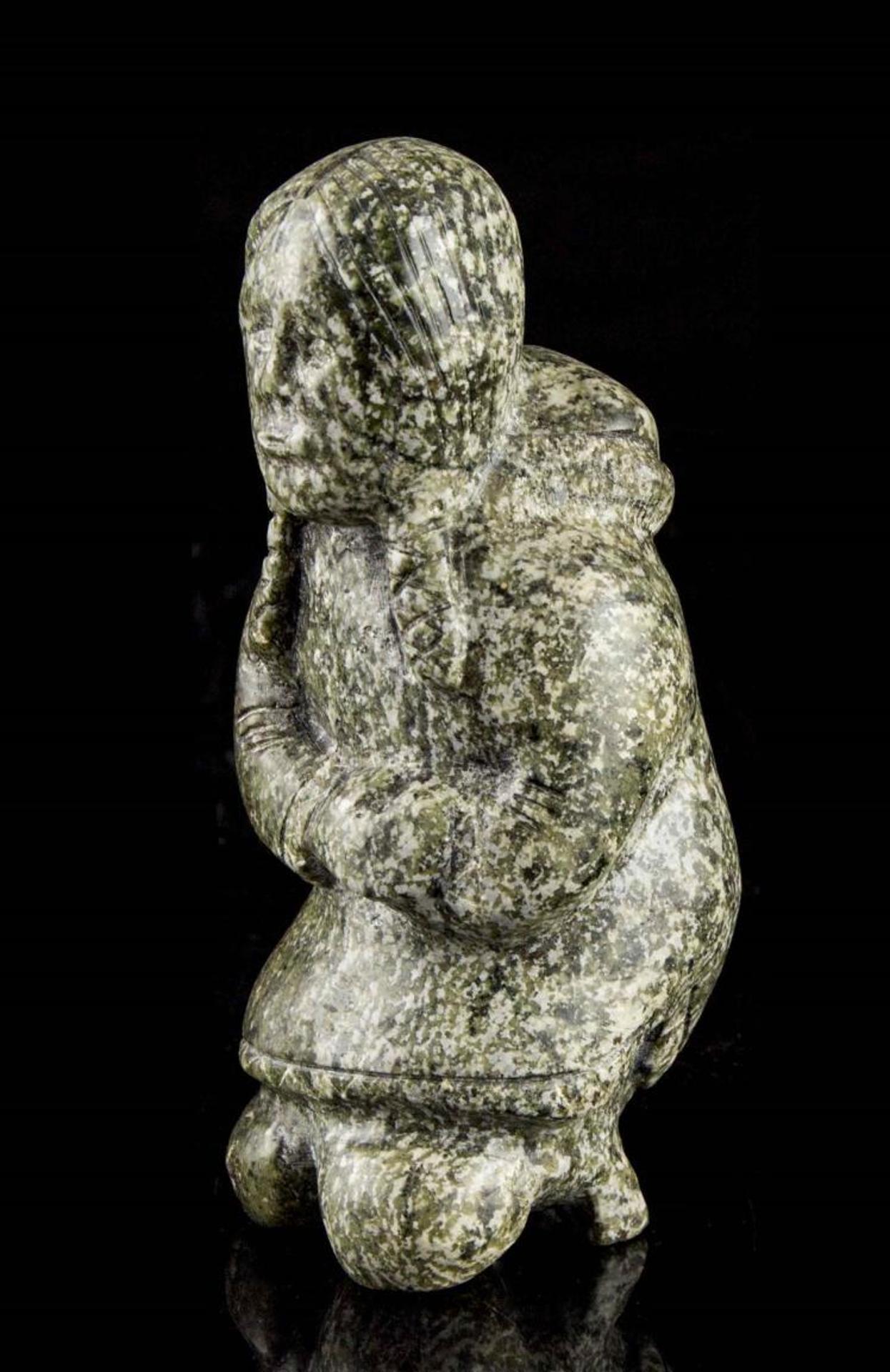 Tommy Tukpanie - Igaluit a green stone carving of a woman