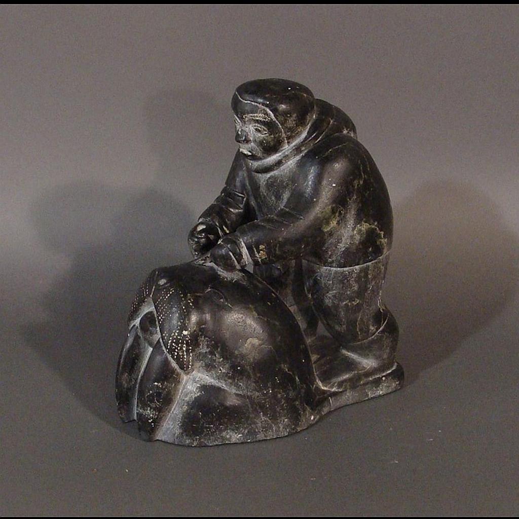 Daniel a - carving of a hunter and walrus