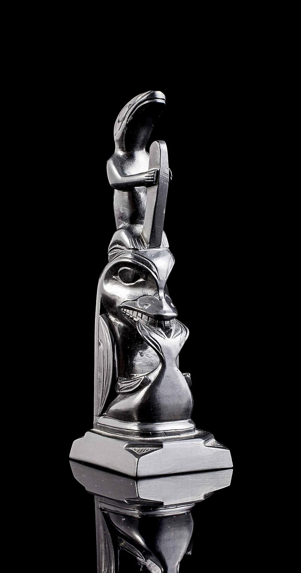 Rufus Moody (1923-1998) - a carved argillite pole depicting Frog atop Killer whale