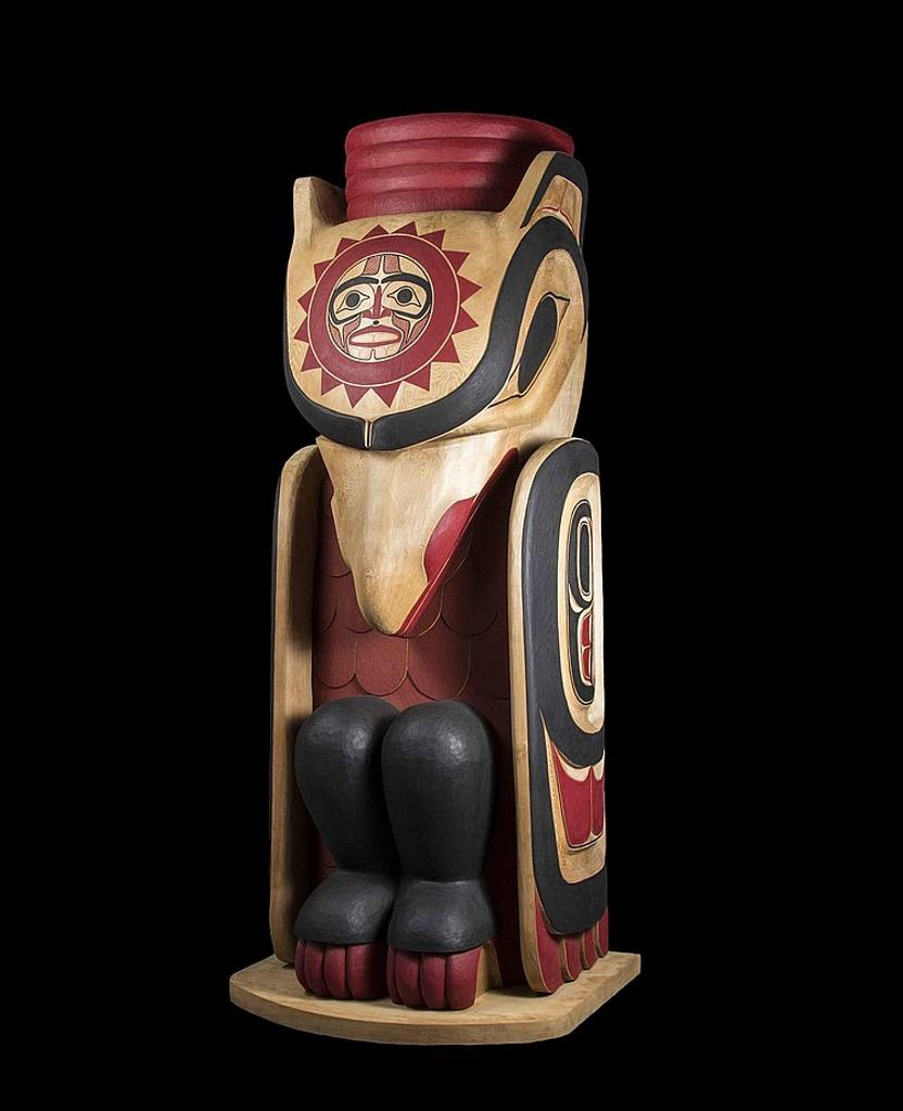Lyle Wilson (1955) - a carved and polychromed cedar house post depicting Raven with an image of the Sun on his head